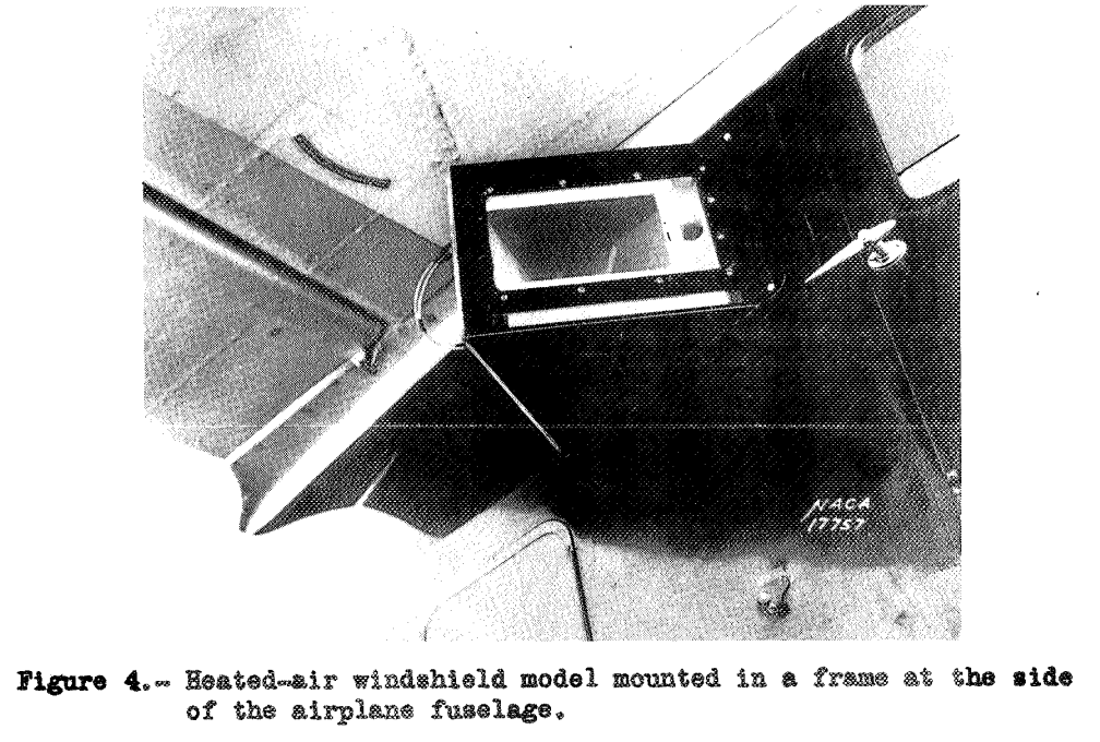 Figure 4. Heated-air windshield model mounted in a frame at the side of the airplane fuselage. 
